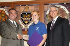 Tiffany Roth ’11 (center), a double major in criminal justice and sociology at The University of Scranton, recently garnered two scholarships from two professional law enforcement organizations. Here, Roth is congratulated by Vincent Carilli, Ph.D., (left), vice president for student affairs, and Donald Bergmann, director of public safety and chief of police.